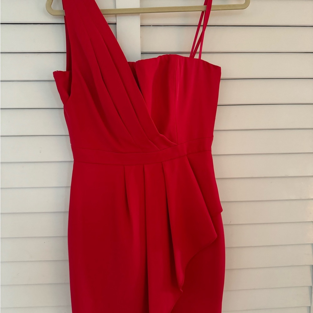 Soft red size 4 BCBD mini dress never worn. Original tag.